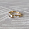 14k yellow gold Rosecliff Grand Ring with a 6 mm round, briolette-cut White Topaz and eight smaller 2 mm round-cut White Topazes