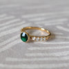 14k gold Rosecliff Grand Ring with 6 mm round, briolette-cut Emerald and eight 2 mm round-cut Diamonds.