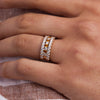 Hand wearing a Rosecliff stackable ring featuring eleven alternating 2mm citrines and diamonds prong set in 14k yellow gold