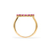 Rosecliff open circle ring featuring sixteen 2 mm faceted round cut rubies prong set in 14k yellow gold - standing view