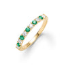 Rosecliff stackable ring featuring eleven alternating 2mm emeralds and diamonds prong set in 14k yellow gold - front view