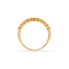 Rosecliff stackable ring featuring eleven 2 mm faceted round cut citrines prong set in 14k yellow gold - standing view