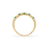 Rosecliff stackable ring featuring eleven alternating 2mm emeralds and diamonds prong set in 14k yellow gold - standing view