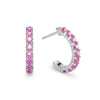 A pair of Rosecliff huggie earrings in 14k white gold each featuring nine 2mm faceted round cut prong set pink sapphires