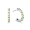 A pair of Rosecliff huggie earrings in 14k white gold each featuring nine 2mm faceted round cut prong set peridots