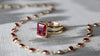 Warren Ruby ring featuring a 10x8mm emerald cut center stone and Newport Ruby necklace featuring 4mm bezel set stones.