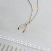 Small White Topaz Wishbone Pendant in Solid 14k Gold (April)