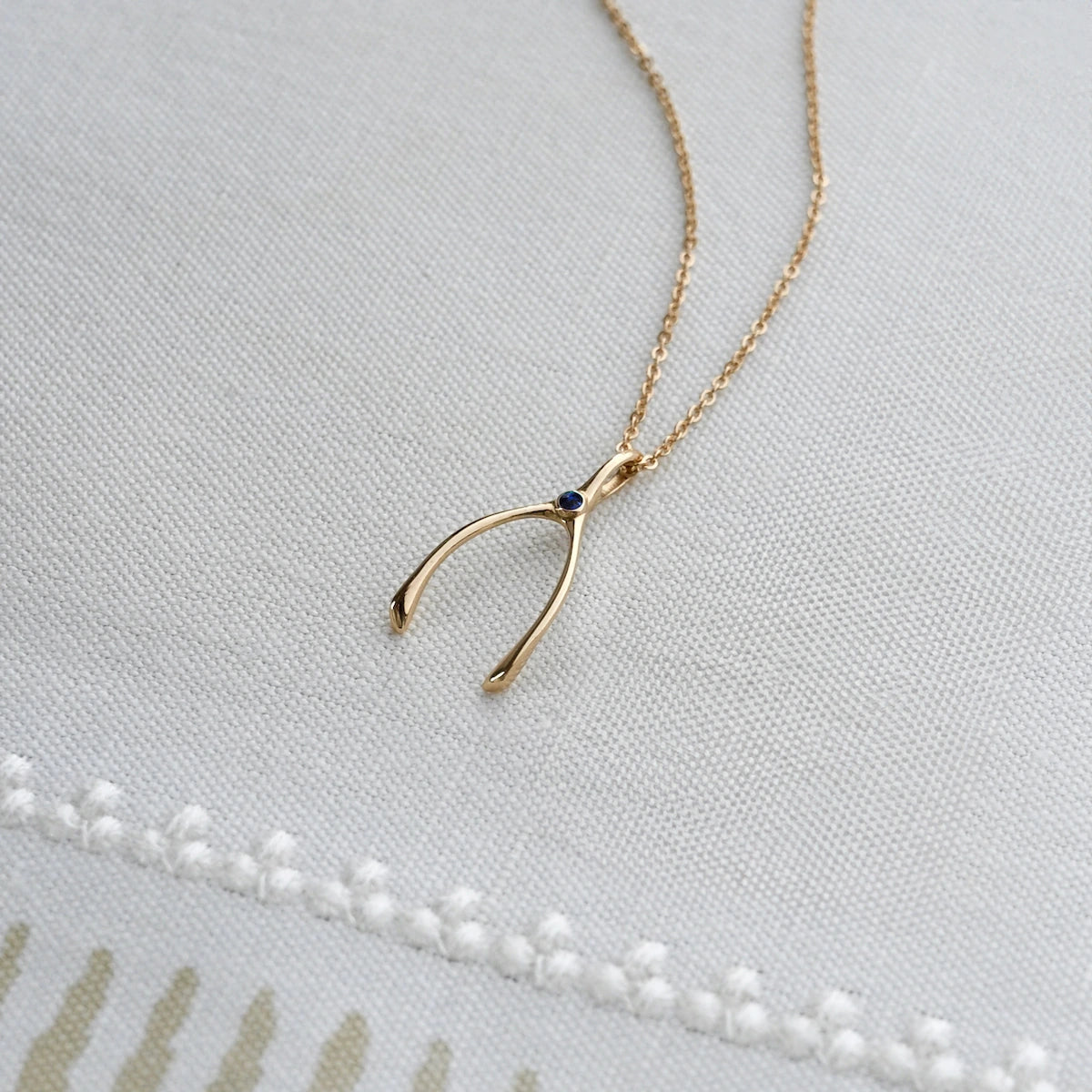 Small Sapphire Wishbone Pendant in Solid 14k Gold (September)