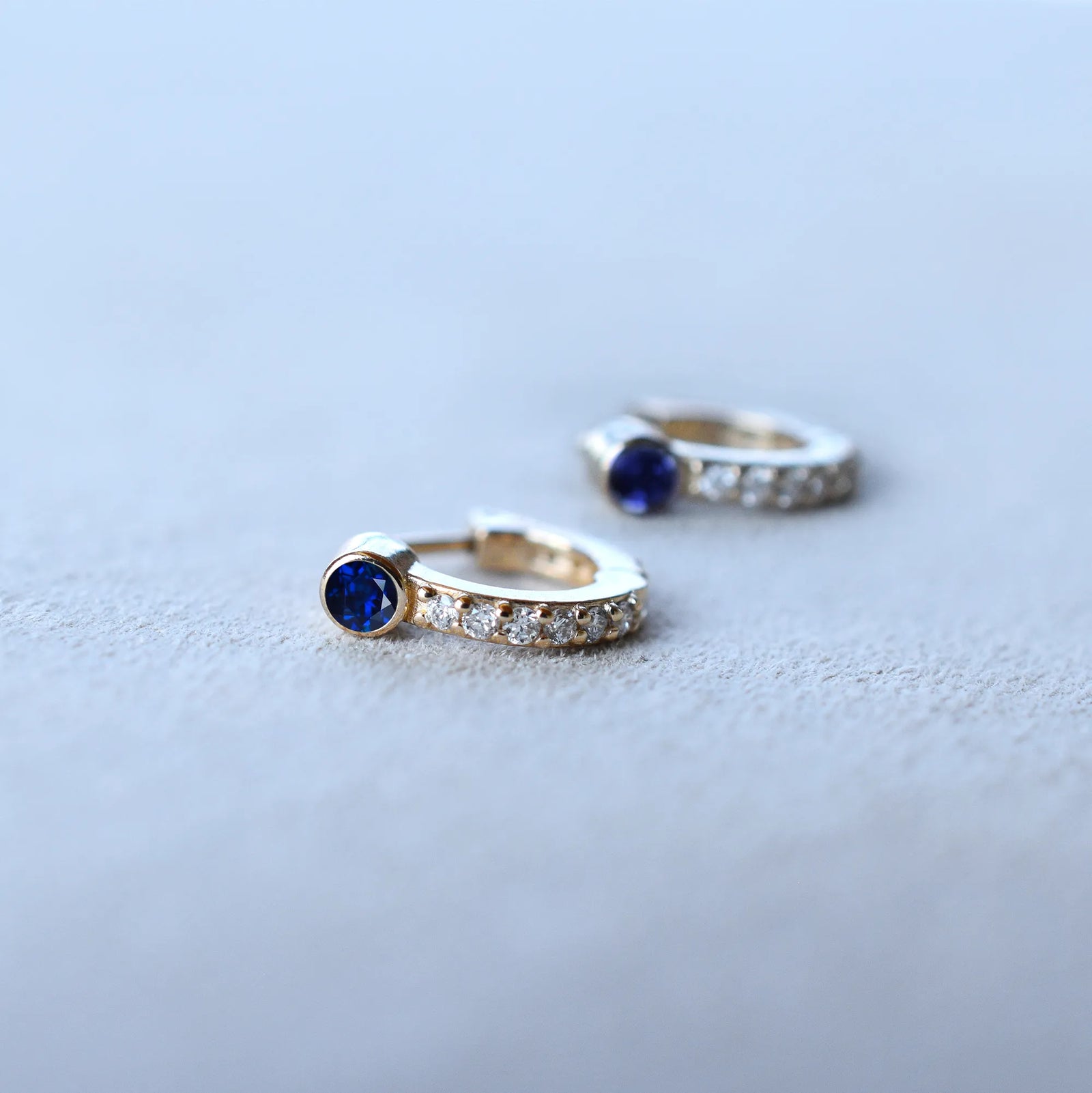 Tiny Sapphire Huggie Hoops with Diamonds in 14k Gold (September)