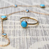 Single Grand Turquoise ring and Bayberry Grand & Classic 11 Turquoise & Nantucket Blue Topaz necklace in 14k yellow gold.