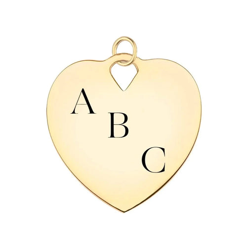 14k yellow gold heart pendant engraved with initials diagonally placed.
