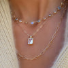Woman wearing a personalized Newport Grand necklace, Warren Pendant with Adelaide Mini chain, and Adelaide necklace.