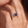 Side view of 14k yellow gold Warren Horizontal Sapphire Ring, featuring an emerald-cut 8 x 10mm sapphire, hand-set horizontally in a 14k-gold bezel.