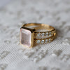 Warren ring in 14k yellow gold with accent diamonds featuring one 10 x 8 mm emerald cut bezel set rose quartz