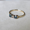 A 14k yellow gold Greenwich ring featuring two 4mm alexandrites and one 2.1mm diamond.