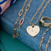 Personalized Adelaide 5 Pavé Link necklace, personalized Large Flat Heart pendant, Warren ring, and Newport necklace.