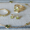 Pair of Greenwich Solitaire Peridot earrings, Warren Lemon Verbena Quartz ring, & Rosecliff Diamond & Peridot Stackable ring.