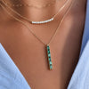 Adelaide Mini necklace, Rosecliff Diamond Bar necklace, and Providence 6 Emerald Pendant featuring six 2x4mm gemstones.