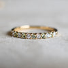 Rosecliff Stackable ring in 14k yellow gold featuring alternating 2mm faceted round cut, prong set diamonds and peridots.