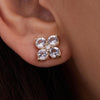 A 14k yellow gold Greenwich 4 Birthstone earring featuring four 4 mm white topaz and one 2.1 mm diamond