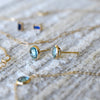 Assorted jewelry and a pair of 14k yellow gold Grand stud earrings each featuring one 6 mm briolette cut Nantucket blue topaz