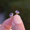 A pair of Grand Birthstone Stud Earrings in 14k Gold featuring 6 mm briolette cut, bezel set Amethyst. 