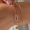 A personalized Classic 4 Birthstone bracelet and a personalized Adelaide 3 Pavé Link bracelet on a woman's wrist.