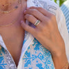 Woman wearing three stacked Rosecliff rings, Adelaide Pavé Link necklace, Adelaide necklace, & Classic 2 Birthstone necklace.