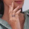 Woman showcasing assorted Rosecliff Rings, including Rosecliff stackable ring featuring eleven 2 mm faceted round cut citrines prong set in 14k yellow gold