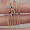Petite gemstone bracelets featuring a single genuine birthstone, bezel set in 14k gold on a delicate chain, crafted for everyday elegance and effortless layering.