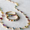 A Newport Rainbow necklace featuring 4mm gemstones and two Rosecliff Rainbow rings, one with alternating diamonds.