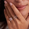 Woman wearing a 14k yellow gold Warren Horizontal Rose Quartz Ring, showcasing an emerald-cut 8 x 10mm Rose Quartz, hand-set horizontally in a 14k-gold bezel.