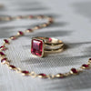 Newport bracelet and a Warren ring in 14k yellow gold featuring one 10 x 8 mm emerald cut bezel set ruby