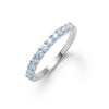Rosecliff stackable ring featuring eleven 2 mm faceted round cut Nantucket blue topaz prong set in 14k white gold