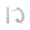 A pair of Rosecliff huggie earrings in 14k white gold featuring nine 2mm faceted round cut prong set aquamarines