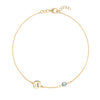14k yellow gold Classic bracelet featuring one aquamarine and one 1/4” flat disc engraved with the letter A - front view