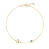 14k gold Classic bracelet featuring one Nantucket blue topaz and one 1/4” flat disc engraved with the letter A - front view