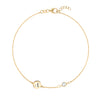 14k yellow gold Classic bracelet featuring one moonstone and one 1/4” flat disc engraved with the letter A - front view