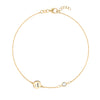 14k yellow gold Classic bracelet featuring one white topaz and one 1/4” flat disc engraved with the letter A - front view