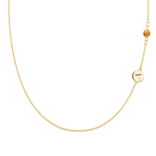 14k gold cable chain Classic necklace featuring one citrine and one 1/4” flat disc engraved with the letter A - front view