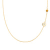14k gold cable chain Classic necklace featuring one citrine and one 1/4” flat disc engraved with the letter A - front view