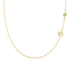 14k gold cable chain Classic necklace featuring one peridot and one 1/4” flat disc engraved with the letter A - front view