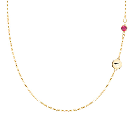 14k gold cable chain Classic necklace featuring one ruby and one 1/4” flat disc engraved with the letter A - front view