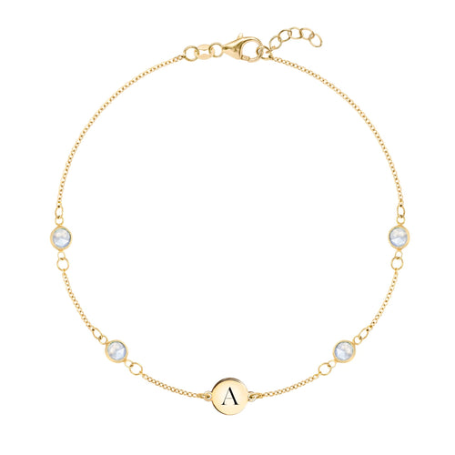 14k yellow gold Classic bracelet featuring four moonstones and one 1/4” flat disc engraved with the letter A - front view