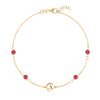 14k yellow gold Classic bracelet featuring four rubies and one 1/4” flat disc engraved with the letter A - front view