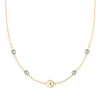 14k gold Classic necklace featuring four aquamarines and one 1/4” flat disc engraved with the letter A - front view