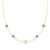 14k gold cable chain Classic necklace featuring four emeralds and one 1/4” flat disc engraved with the letter A - front view