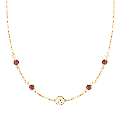 14k gold cable chain Classic necklace featuring four garnets and one 1/4” flat disc engraved with the letter A - front view