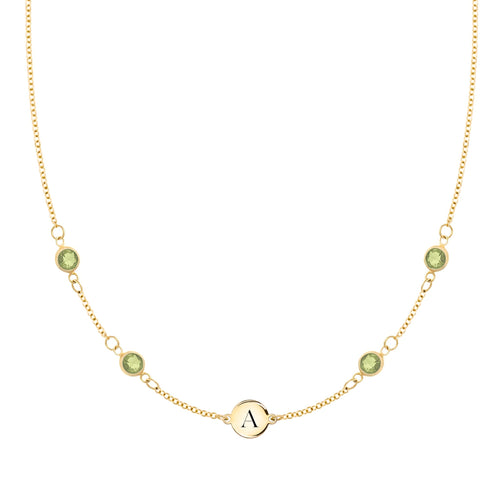 14k gold cable chain Classic necklace featuring four peridots and one 1/4” flat disc engraved with the letter A - front view
