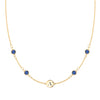 14k gold cable chain Classic necklace featuring four sapphires and one 1/4” flat disc engraved with the letter A - front view